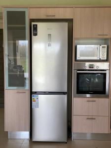 Kuchyň nebo kuchyňský kout v ubytování Stellar Beachhouse