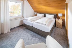 מיטה או מיטות בחדר ב-Haus Ferienglück