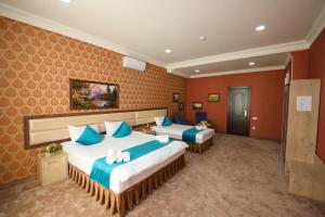 Ένα ή περισσότερα κρεβάτια σε δωμάτιο στο HOTEL GLOBUS