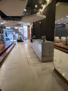 a lobby with a reception desk in a building at The Franklin Luxury Apartments, Unit 1604 in Johannesburg