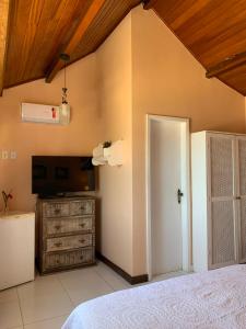 Cama ou camas em um quarto em Pousada Solar da Praia