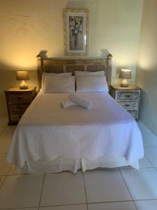 Cama ou camas em um quarto em Pousada Solar da Praia