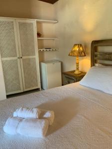 Cama ou camas em um quarto em Pousada Solar da Praia