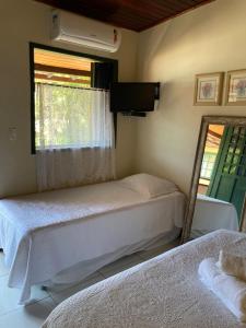 Cama ou camas em um quarto em Pousada Solar da Praia