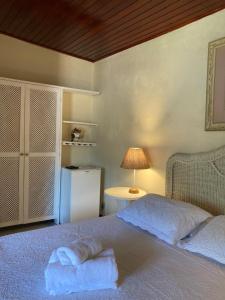 Cama ou camas em um quarto em Pousada Solar da Praia