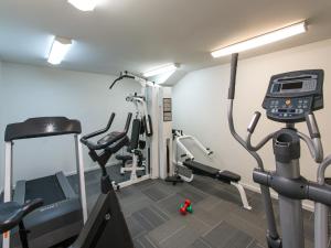a gym with two tread machines and a treadmill at The Chancellor on Currie in Adelaide