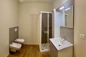 a bathroom with a sink and a toilet at Savenella Apartments in Bologna
