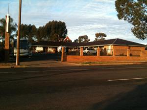 a bus parked on the side of a road at Cobar Town & Country Motor Inn in Cobar