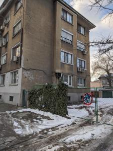 an apartment building with graffiti on the side of it at Midtown Place Apartment DORIS 1 with garage in Plovdiv