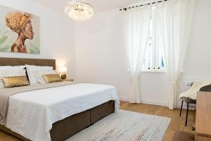 Posteľ alebo postele v izbe v ubytovaní Aurelia Residence