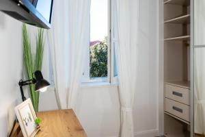 Televízia a/alebo spoločenská miestnosť v ubytovaní Aurelia Residence
