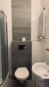 Ett badrum på Bianco - pokoje noclegowe