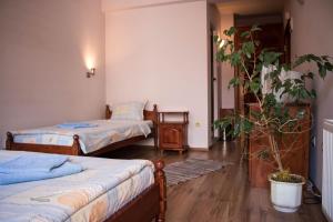 Postel nebo postele na pokoji v ubytování Guest House Ilinden