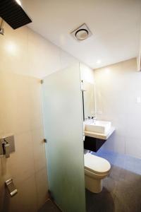 A bathroom at Ocean Suites Bohol Boutique Hotel