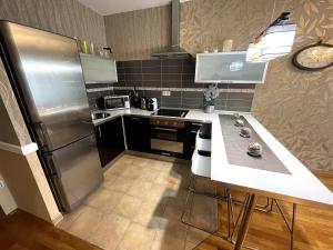 Kuchyň nebo kuchyňský kout v ubytování Apartment 122 Čertovka