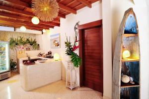 a room with a wooden door and a counter at Villa Domus De Janas in Seminyak