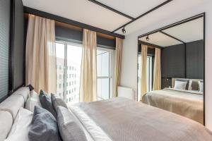 Posteľ alebo postele v izbe v ubytovaní Super-Apartamenty International Fair