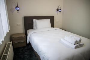 Postel nebo postele na pokoji v ubytování Hotel Guzy