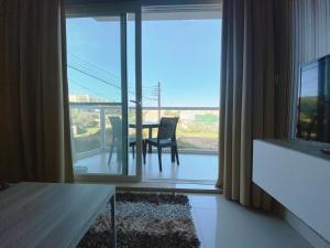 TV a/nebo společenská místnost v ubytování Vista Point - Cast Renting