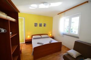 Postel nebo postele na pokoji v ubytování Apartments Šimić