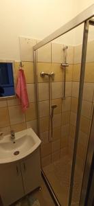 a bathroom with a shower and a sink at Helly's apartman - self check-in - in Jajce +14 photos