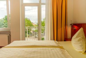 Ліжко або ліжка в номері Parkhotel Friedrichstrasse