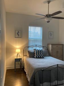a bedroom with a bed with a ceiling fan at New Orleans Home Sweet Home in New Orleans