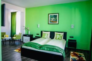 Colors Residence tesisinde bir odada yatak veya yataklar