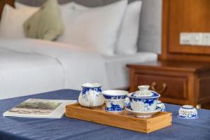 เตียงในห้องที่ Fliport Garden Hotel Wuyishan