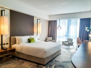 The Excelsior Hotel Las Piñas客房内的一张或多张床位