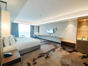 The Excelsior Hotel Las Piñas客房内的一张或多张床位