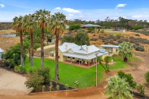 an overhead view of a house with palm trees at The River Block in Berri