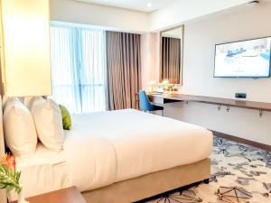 The Excelsior Hotel Las Piñas客房内的一张或多张床位