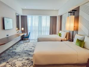 The Excelsior Hotel Las Piñas客房内的一张或多张床位