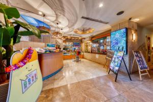 a restaurant with a surfboard in the middle of a room at Hotel Atlantis Hawaiian Resorts(Adult only) in Saitama