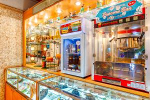 a display case in a store with many different items at Hotel Atlantis Hawaiian Resorts(Adult only) in Saitama
