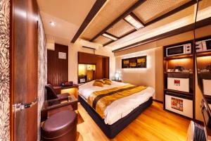 Postel nebo postele na pokoji v ubytování HOTEL Lotus Shibuya (Adult Only)