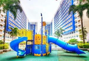 a playground with a slide in a city at LIAM's Staycation in Manila