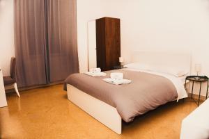 A bed or beds in a room at Mamamia #Politeama