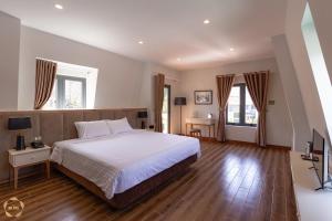Postel nebo postele na pokoji v ubytování Hotel Du Ciel
