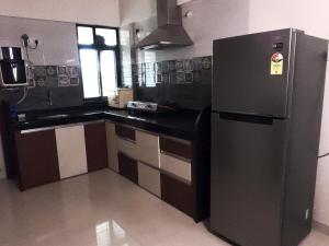 Leisurely Abode Service Apartments And Homestay 주방 또는 간이 주방