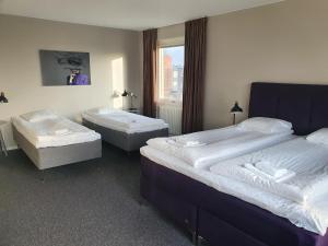 Postel nebo postele na pokoji v ubytování BriQ Hotell + 36 fotografií