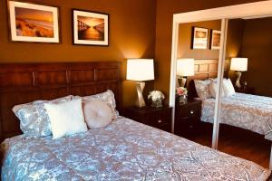 a bedroom with two beds with pillows and two lamps at Luxury stay near Santana Row for vacation/business in San Jose