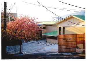 a house with a fence in front of it at HOTEL HIMALAYA SEA in Ito