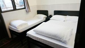 Postel nebo postele na pokoji v ubytování Kowloon Mongkok 1812 Guest House