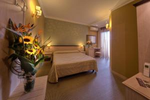 Кровать или кровати в номере Hotel Galileo