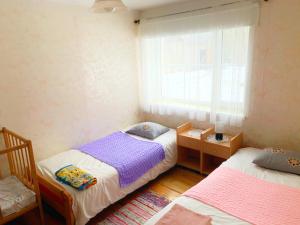 Postel nebo postele na pokoji v ubytování Vana-Vastseliina külalistemaja
