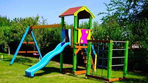 a playground with two slides and a play structure at Вила Релакс - Villa Relax in Sokolovo
