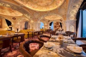 a restaurant with tables and chairs and a ceiling at arte by Thomas Chan in Kuala Lumpur