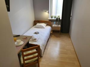 Posteľ alebo postele v izbe v ubytovaní Jasna Hotelik self check-in